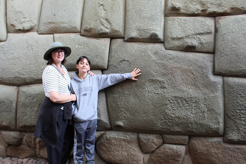 Mother and son next to the twelve-angled stone
